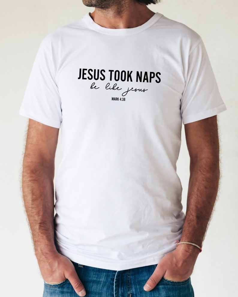 May include: White t-shirt with black text that reads "JESUS TOOK NAPS be like jesus MARK 4:38"