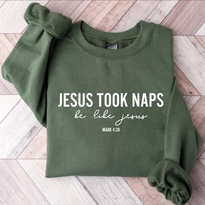 May include: A green sweatshirt with the text "JESUS TOOK NAPS be like jesus MARK 4:38" printed in white.