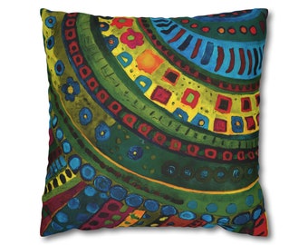 May include: A colorful throw pillow with a geometric pattern in shades of green, blue, red, yellow, and orange. The pattern features circles, squares, and lines.