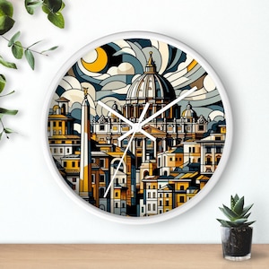 May include: A white round clock with a colorful illustration of the skyline of Rome, Italy. The clock face features a white background with black clock hands and black Roman numeral hour markers. The illustration features a yellow, orange, and blue color scheme and depicts the iconic St. Peter's Basilica.