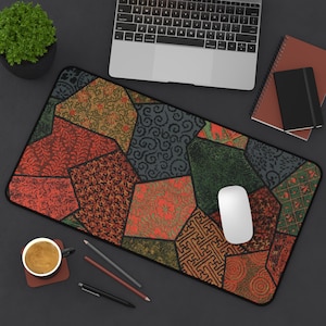 May include: A colorful patchwork mouse pad with a variety of geometric patterns in shades of red, green, blue, and brown. The mouse pad is made of a durable material and is perfect for protecting your desk from scratches.