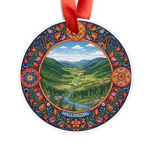 May include: A round ornament with a scenic landscape of a valley, river, and mountains. The ornament has a red ribbon for hanging. The border is decorated with colorful floral patterns in blue, orange, and red. The word "HALLINGDAL" is printed on the bottom.