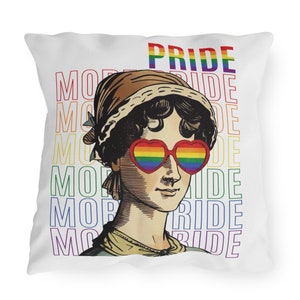 May include: White square pillow featuring a vintage illustration of a woman wearing heart-shaped rainbow sunglasses. The word "PRIDE" is printed in rainbow colors at the top, with the word "MORE" repeated vertically in rainbow colors.