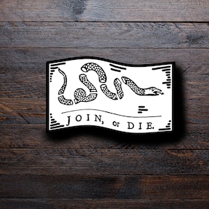 May include: A black and white rectangular sticker featuring a segmented snake and the words "JOIN, or DIE." The snake is in the center, with its segments separated. The text is in a bold, serif font.
