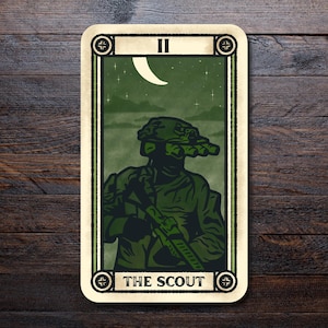 May include: A tarot card illustration depicting a soldier in green night vision gear, holding a rifle. The card has a cream border and the text "II" and "THE SCOUT". A crescent moon and stars are in the background, creating a night scene.