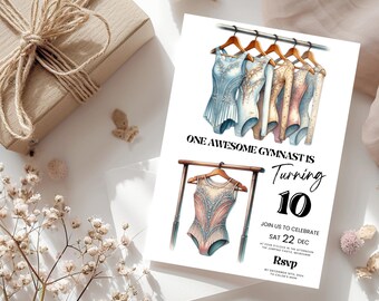 Peut inclure: Une invitation d'anniversaire avec des illustrations à l'aquarelle de justaucorps de gymnastique sur des cintres. Le texte indique "ONE AWESOME GYMNAST IS Turning 10" avec les détails de la célébration. Une boîte cadeau emballée et des accents floraux complètent le design.