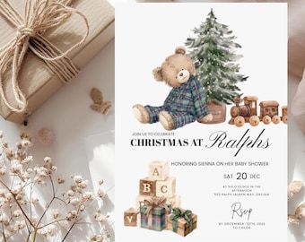 May include: A baby shower invitation with a Christmas theme. The invitation features a watercolor illustration of a teddy bear in plaid pajamas, a Christmas tree, and a toy train. Text includes "Christmas at Ralphs" and event details.