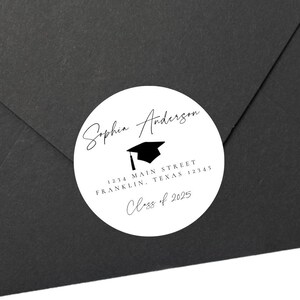 May include: White round sticker with black text and a graduation cap icon. The text reads "Sophia Anderson", "1234 Main Street", "Franklin, Texas 12345", and "Class of 2025".