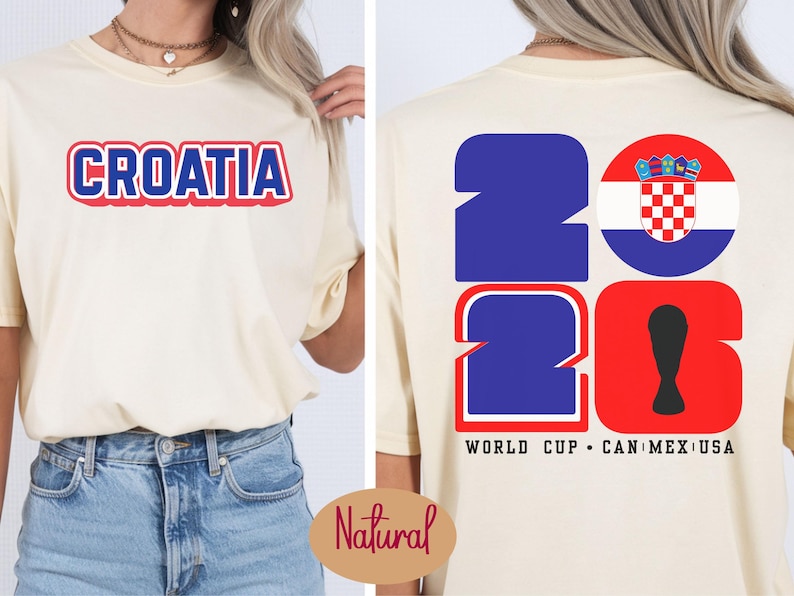 May include: Cream-colored t-shirt with the word "CROATIA" in red and blue lettering on the front. The back features the numbers "2026" in blue and red, with a Croatian flag emblem and the text "WORLD CUP CAN MEX USA".