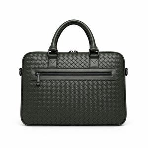 May include: A black briefcase featuring a woven leather exterior pattern. The bag includes two rounded top handles, a horizontal zippered pocket on the front face with a matching black zipper pull, and side metal rings for an optional shoulder strap.
