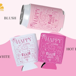 May include: Pink and white can coolers with the text "HAPPY 21st Birthday ELLIE 6.01.2025 GREECE". The image shows a blush-colored can with a matching cooler, and two additional coolers in white and hot pink.