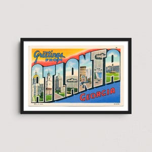 May include: A framed vintage postcard featuring the words "Greetings from Atlanta Georgia." The word "Atlanta" is segmented, with each letter showcasing a different Atlanta landmark. The sky is a gradient of yellow, orange, and blue.