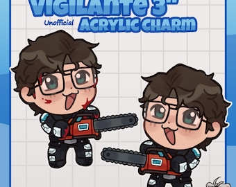 Op de afbeelding: Twee 3-inch acryl bedels met een chibi-figuur met bruin haar, een bril en een zwart pak, die een rode kettingzaag vasthoudt. De tekst luidt VIGILANTE 3" UNOFFICIAL ACRYLIC CHARM. Een klein figuurtje met een witte hoofdband staat onderaan.