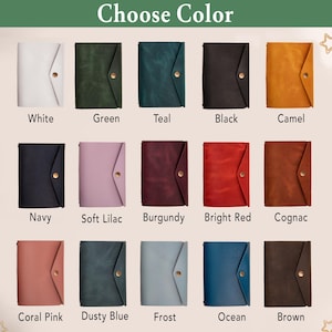 May include: A selection of leather journals in various colors, including white, green, teal, black, camel, navy, soft lilac, burgundy, bright red, cognac, coral pink, dusty blue, frost, ocean, and brown. Each journal has a button closure. The text "Choose Color" is at the top.