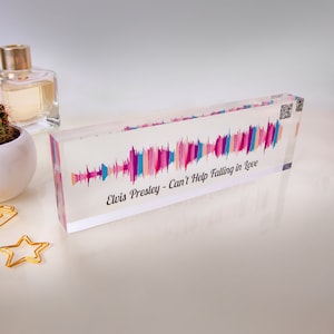 May include: A clear acrylic block with a colorful sound wave graphic and the text "Elvis Presley - Can't Help Falling in Love".