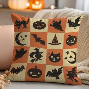 May include: Halloween-themed throw pillow with a patchwork design. The pillow features black silhouettes of cats, pumpkins, ghosts, bats, witches, and moons on a cream and orange background. A decorative accent for the fall season.