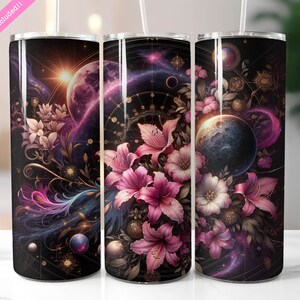 May include: Three stainless steel tumblers with a galaxy and floral design. The tumblers feature a dark background with pink, white, and gold flowers, planets, and stars.