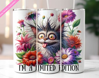 May include: A white stainless steel tumbler with a colorful illustration of a cat with crazy hair surrounded by flowers. The text "I'M A LIMITED EDITION" is printed on the bottom of the tumbler.