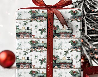 May include: A white gift wrap with a repeating pattern of green and red vintage train engines, holly, and snowflakes. A red ribbon with white polka dots is tied around the box.