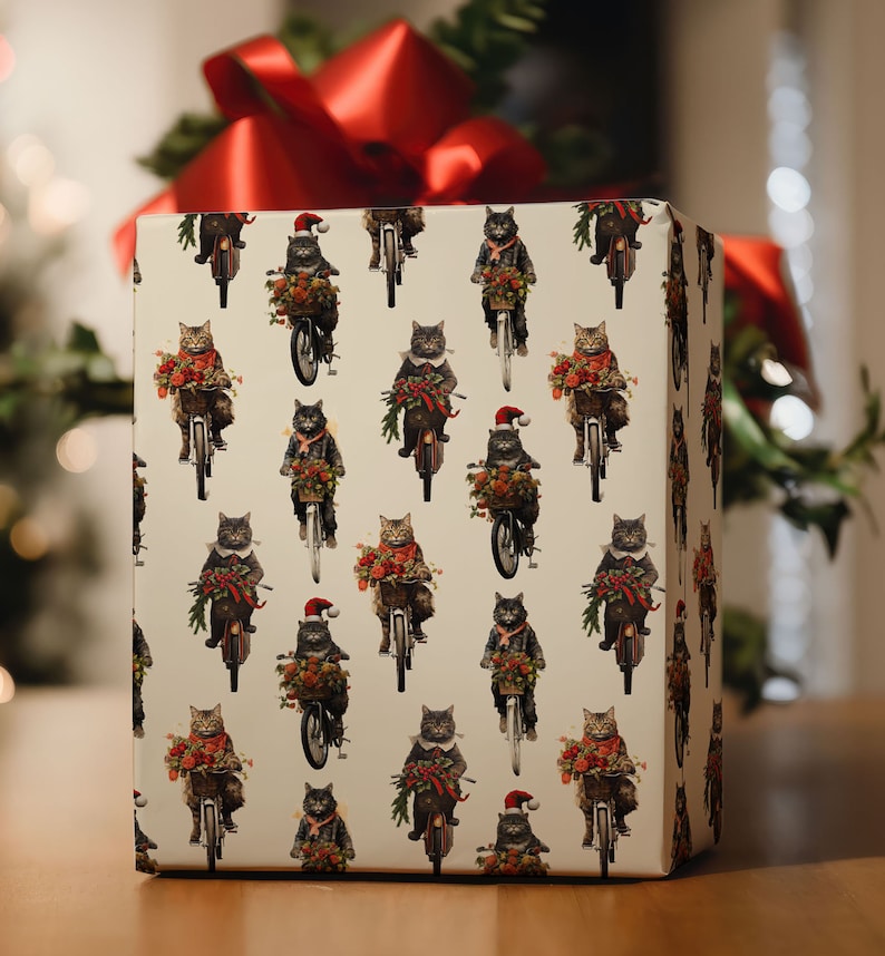 May include: White gift wrap with a repeating pattern of cats riding bicycles. The cats are wearing Santa hats and carrying Christmas presents. The background is white with red and green accents.