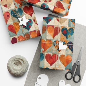 May include: Three gift boxes wrapped in colorful patchwork paper with a heart pattern. The paper features a variety of colors, including red, orange, blue, and green. The boxes are tied with twine and decorated with white paper tags.