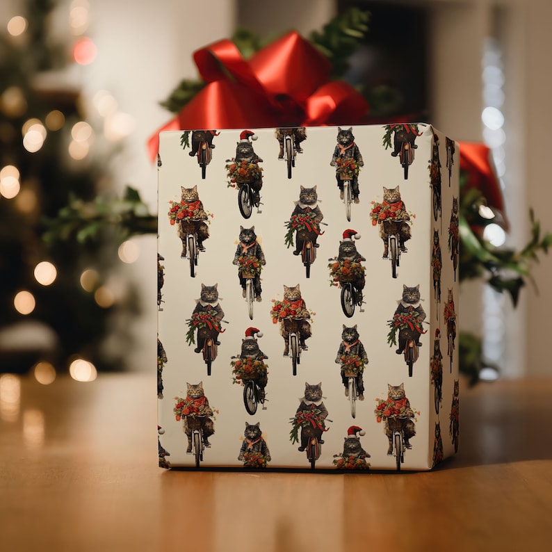 May include: White gift wrap with a repeating pattern of black cats riding motorcycles and wearing Santa hats. The cats are holding Christmas greenery and ornaments.