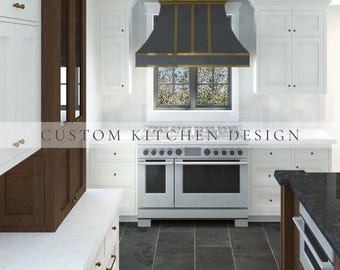 May include: A kitchen interior featuring white cabinetry, dark wood accents, and a large stainless steel range with a dark gray and gold metal range hood. The text CUSTOM KITCHEN DESIGN is overlaid across the center of the image above the stove.