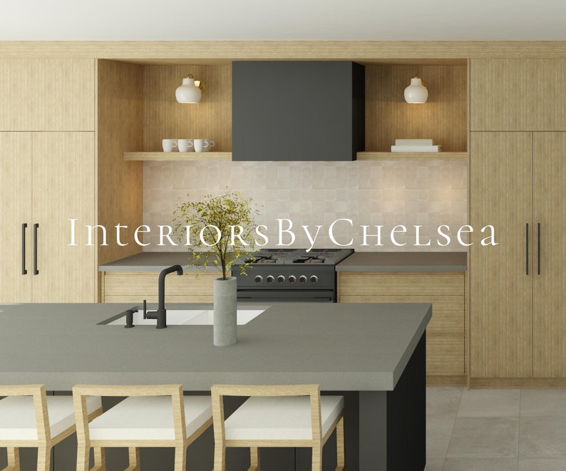 May include: A modern kitchen with light wood cabinets, a black range hood, and a gray kitchen island with bar stools. The text "Interiors By Chelsea" is displayed on the wall.