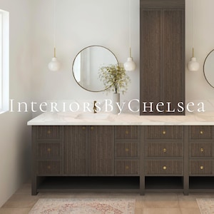May include: A modern bathroom vanity with a white marble countertop and dark wood cabinets. The vanity has two sinks, two round mirrors, and gold hardware. The vanity is in front of a white wall with a window.