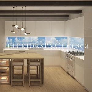 May include: A modern kitchen with white cabinets and a wooden island with bar stools. The kitchen has a large window with a view of the ocean and sky. The text "Interiors By Chelsea" is visible in the image.