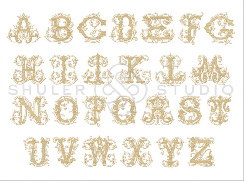 May include: A complete alphabet of capital letters from A to Z, rendered in a light tan, ornate, and decorative font style with intricate scrollwork details. The text SHULER STUDIO is visible in the center of the image in a light gray font.