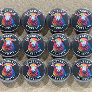 May include: Twelve round black and white buttons with a rainbow sheep graphic and the text "Celebrate Diversity".