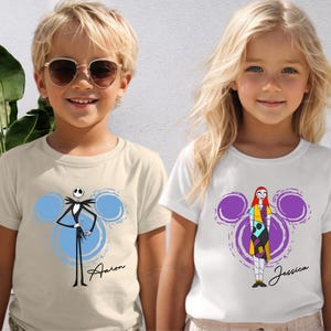 A boy and a girl wearing t-shirts with cartoon characters from the movie " Nightmare Before Christmas".