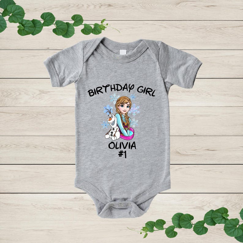 a baby bodysuit with a picture of a girl on it
