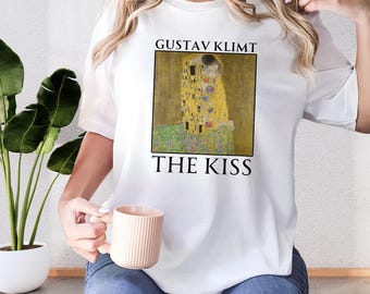 Camiseta "El beso" de Gustav Klimt, una obra de arte famosa, ideal como regalo para amantes del arte.