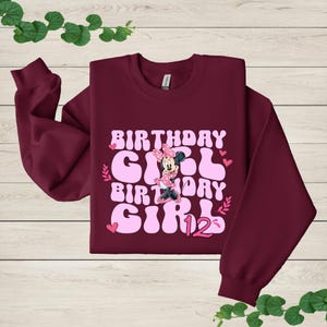a sweatshirt with a minnie mouse design on it