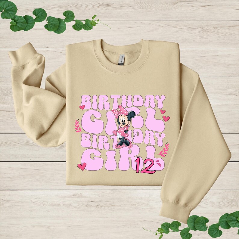 a sweater with a minnie mouse design on it