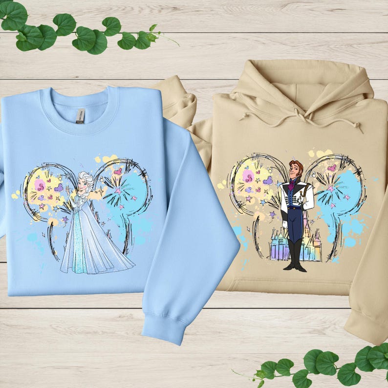 a couple of sweatshirts sitting on top of a wooden table