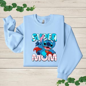 a blue sweatshirt with a cartoon character on it