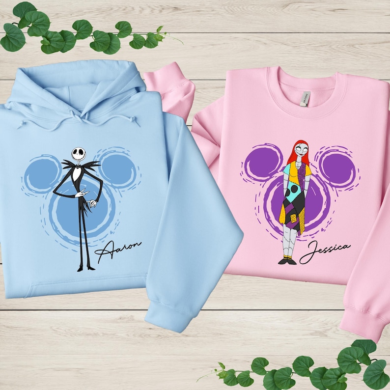 two sweatshirts with cartoon characters from the movie " jack Skellington and Sally" printed on them.