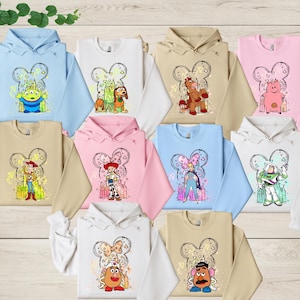 a group of children's hoodies with cartoon characters on them