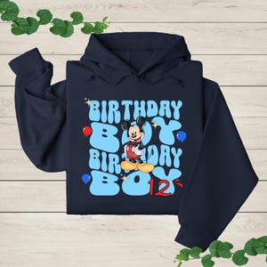 a hoodie with a mickey mouse design on it