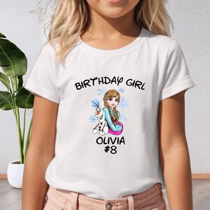 a young girl wearing a birthday girl shirt