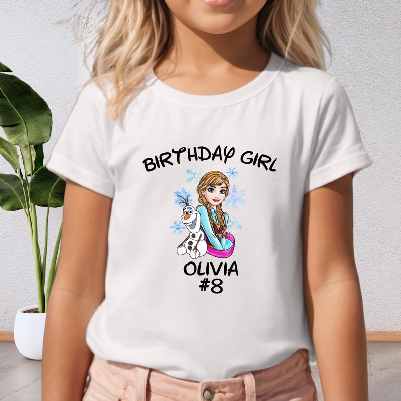 a young girl wearing a birthday girl shirt