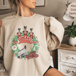 Retro Christmas Sweatshirt Unisex Nostalgic Holiday Movie Inspired Pullover Vintage Duncans Toy Chest Graphic Cozy Holiday Sweatshirt Unisex