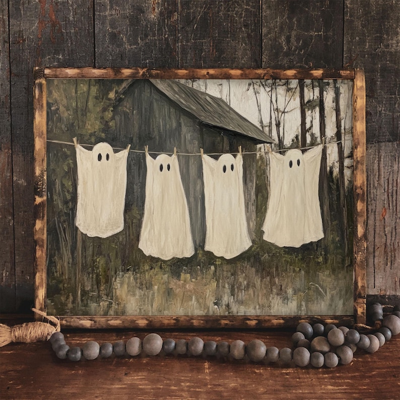 May include: A painting of four white ghosts hanging on a clothesline in front of a wooden building. The ghosts are all different sizes and shapes, and they are all smiling. The painting is set against a backdrop of a dark forest.