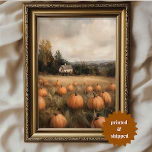 May include: A framed painting depicting a rural scene with a white farmhouse in the distance. The foreground features a field of pumpkins in various shades of orange.