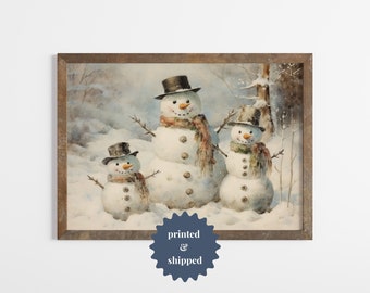 May include: A watercolor painting of three snowmen in a winter scene. The snowmen are wearing hats and scarves. The largest snowman is in the center of the painting, and the two smaller snowmen are on either side of him. The snowmen are standing in a snowy field, and there are trees in the background.