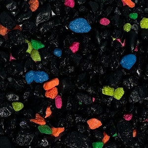 May include: Black lava rock aquarium gravel with colorful accents. The gravel is a mix of black, blue, green, orange, and pink.
