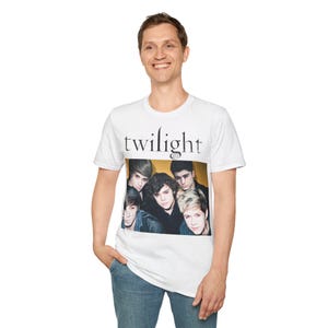 May include: White t-shirt featuring a black and white graphic of a band. The graphic includes the text "twilight" and a band of five young men.